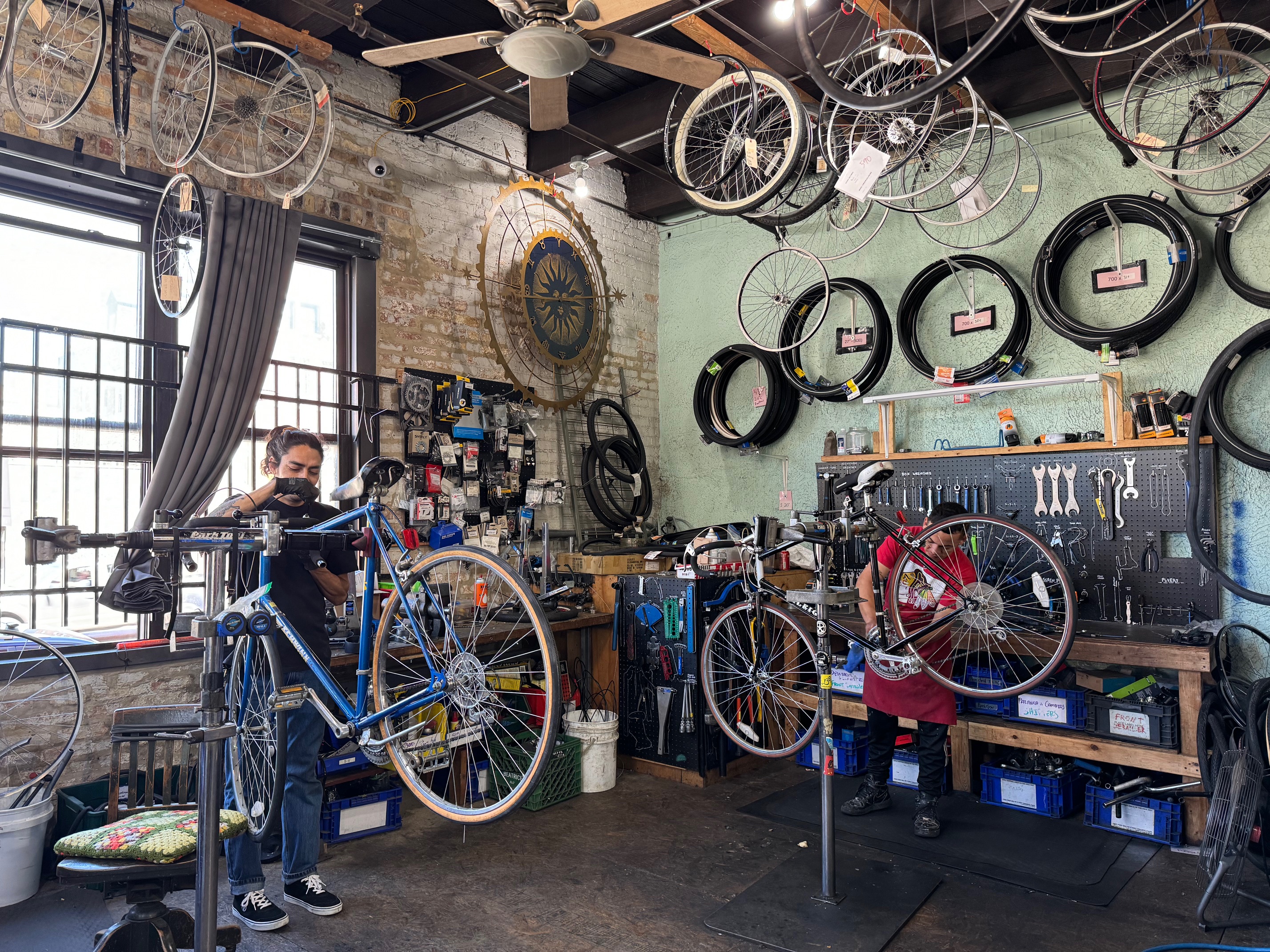 A warehouse holds lots of bikes lined up together